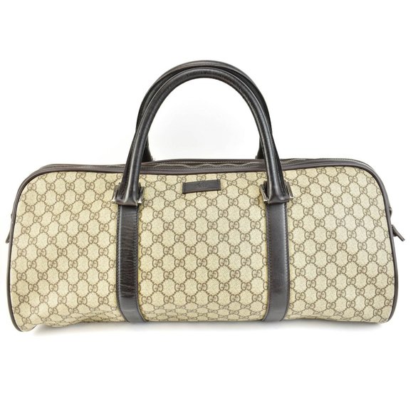 GUCCI: Brown Leather, & GG Logo Large Weekender ve